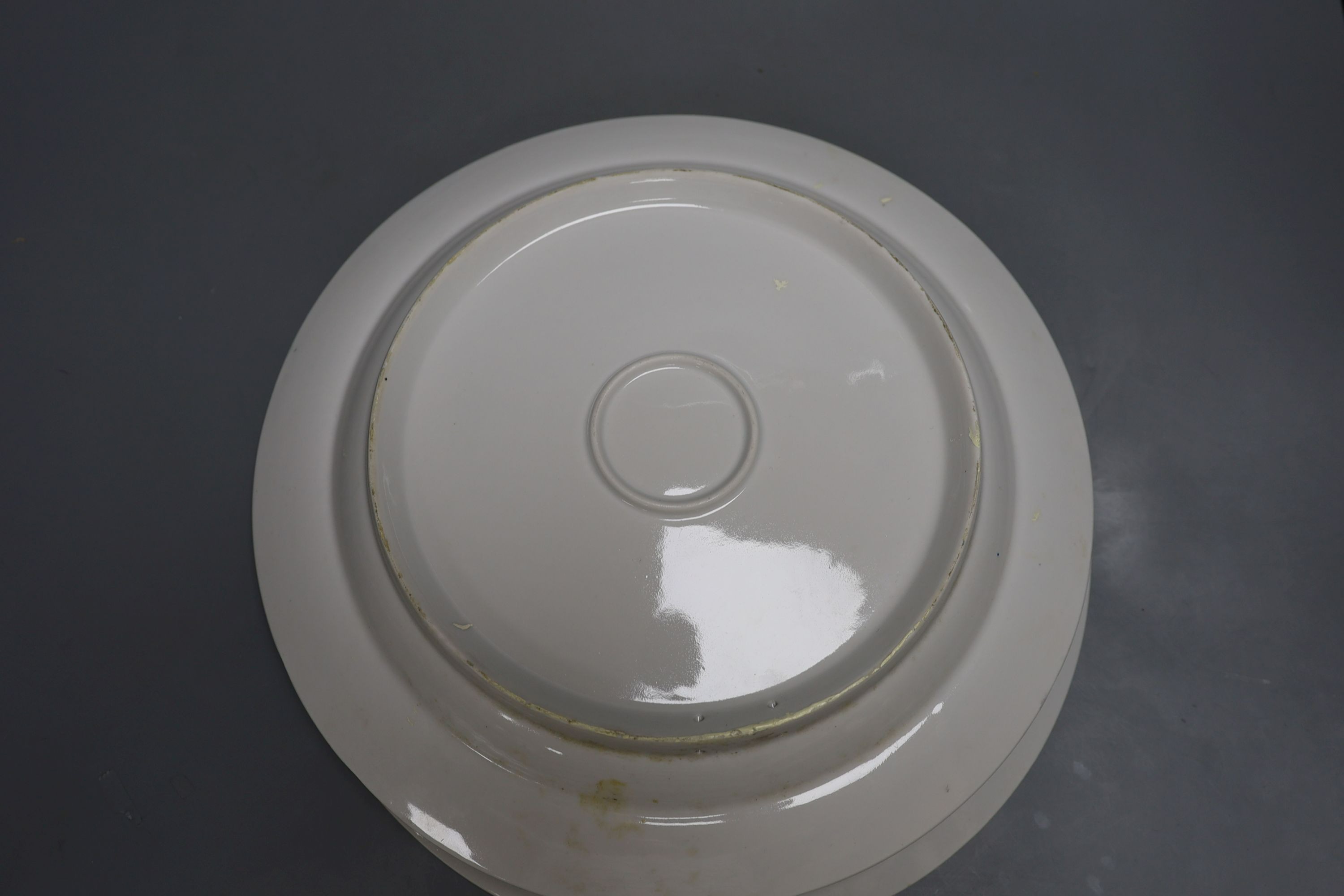 A pair of Russian porcelain dishes, painted by Malysheva and dated 1992, 35cm diameter
